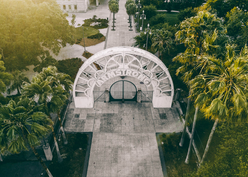 A photograph of the Armstrong Arch in New Orleans Louis Armstrong Park taken from a drone.