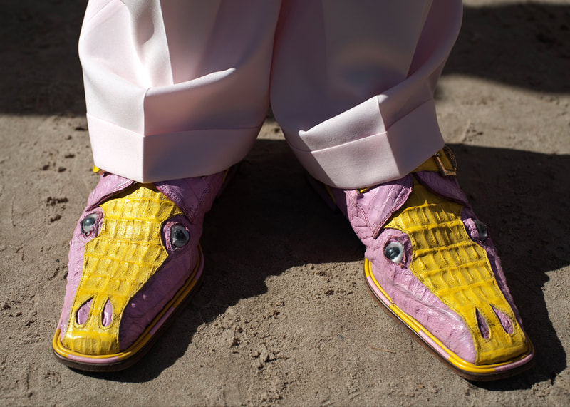 A postcard of a pastel pair of Alligator loafers from a New Orleans Second Line Parade.